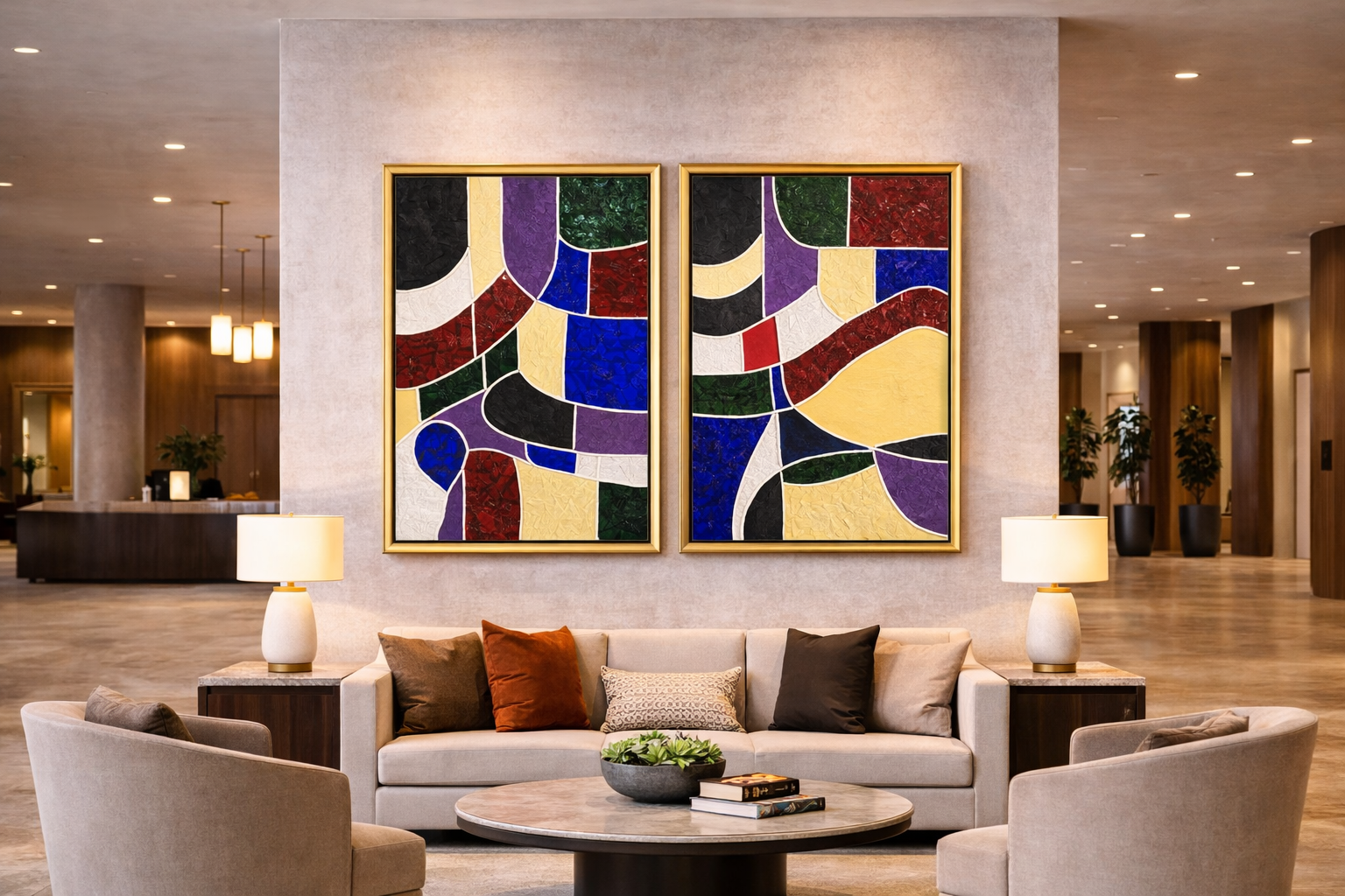 Luxurious hotel lobby featuring a diptych of large colorful abstract textured paintings with gold frames displayed above a contemporary lounge seating area.