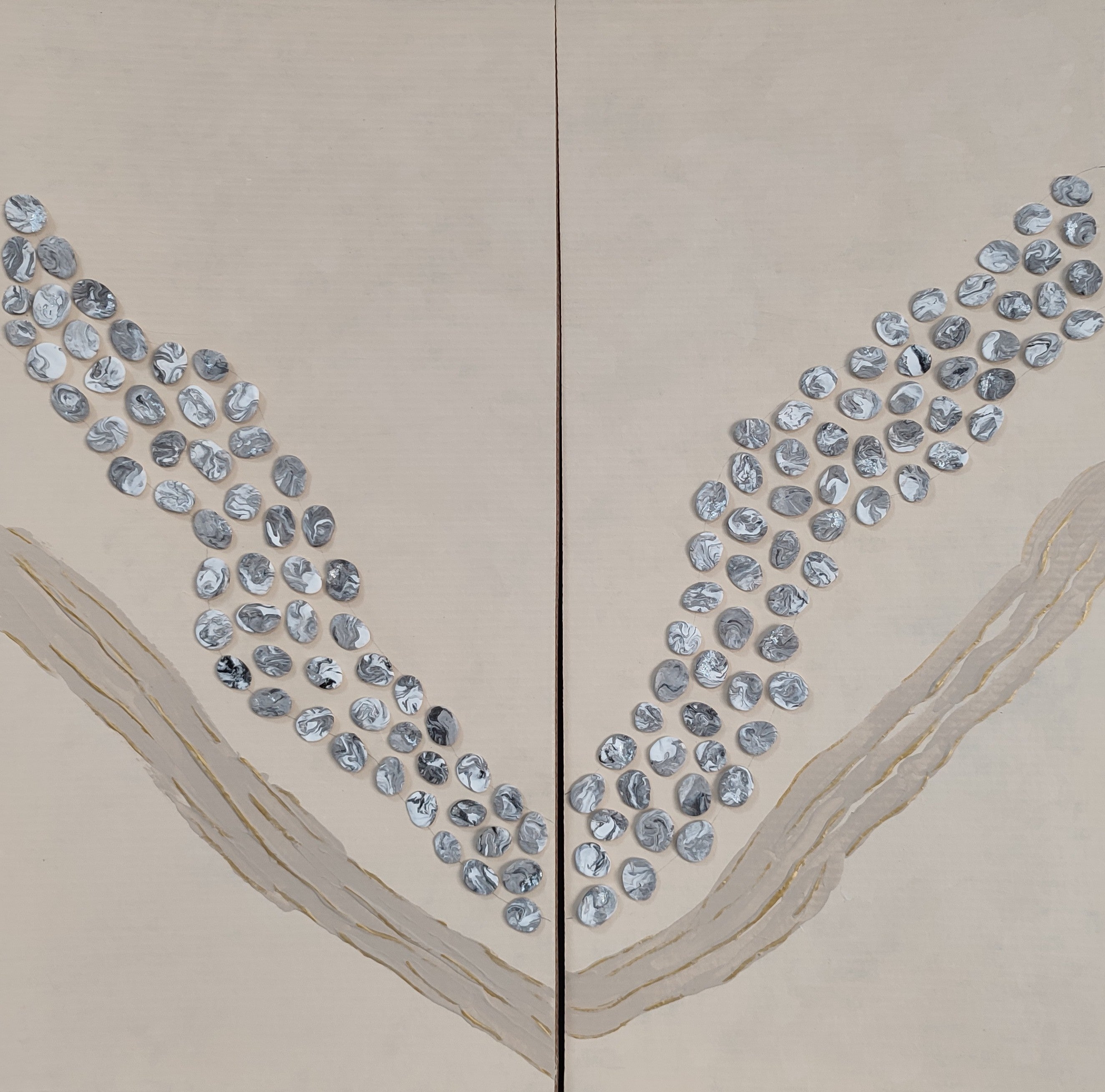 Decorative wall art with blue circular patterns on a beige background