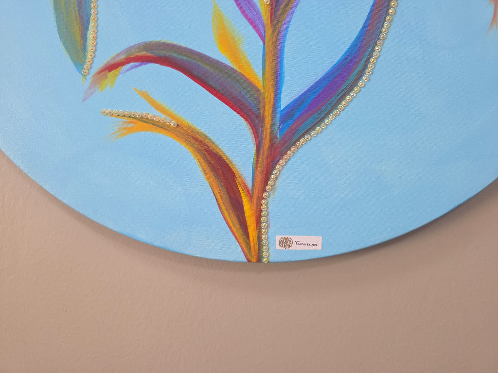 Colorful abstract design on a circular object with a brand logo at the bottom.