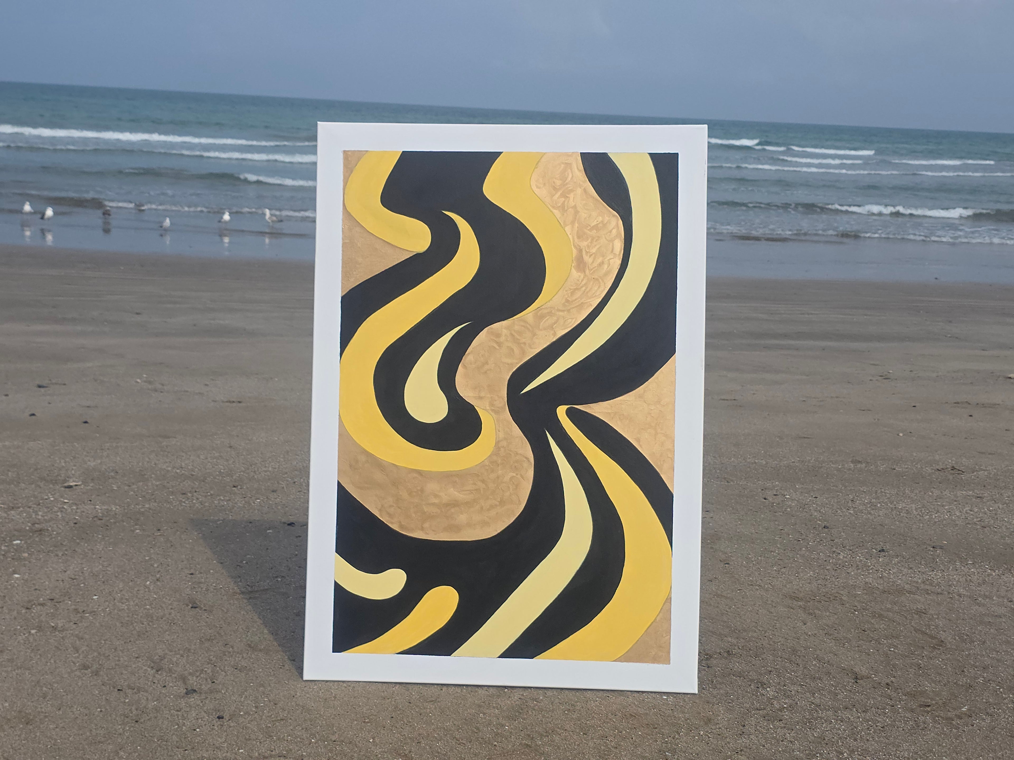 Abstract art print with wavy patterns on a beach