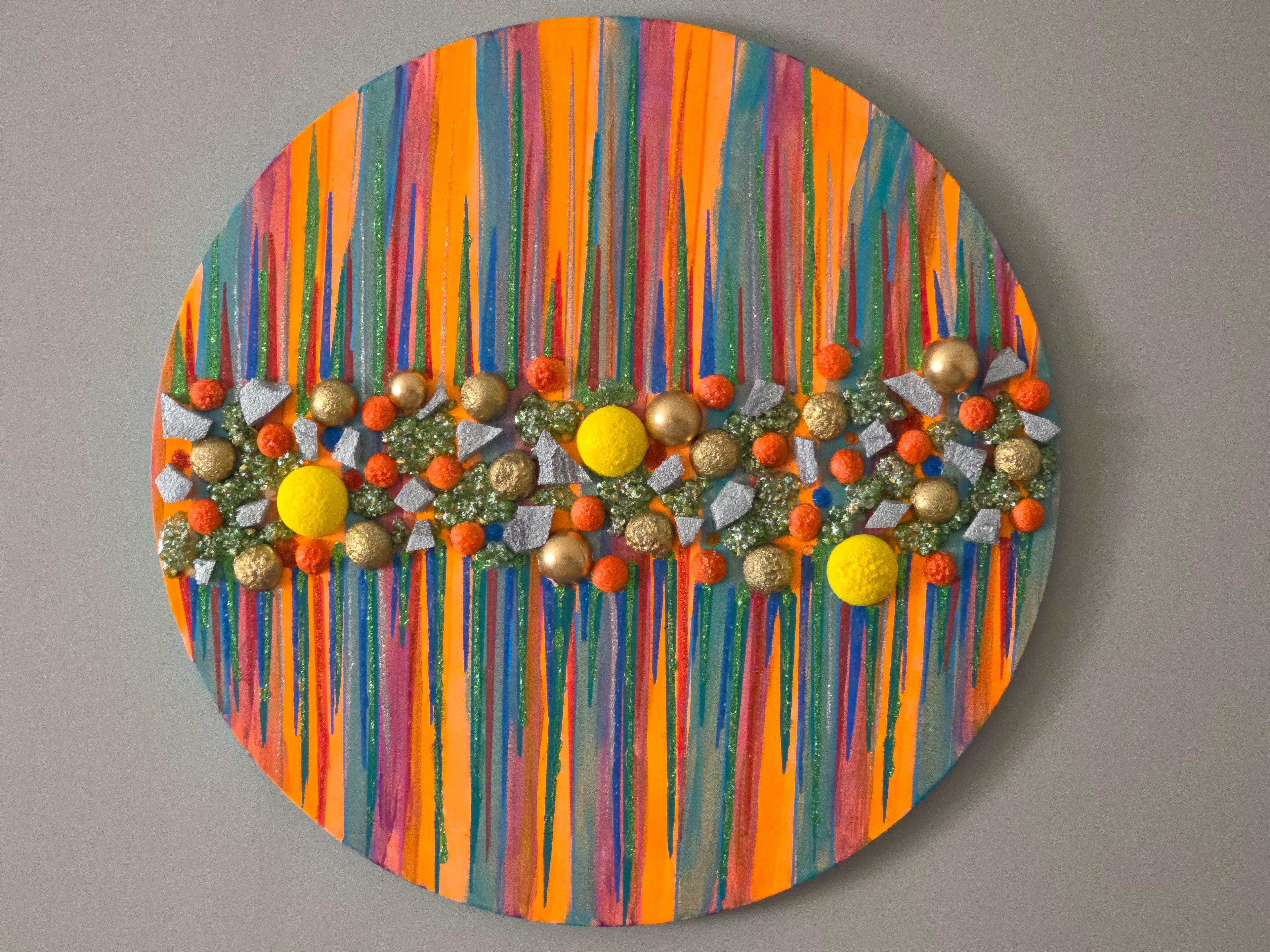 Vibrant modern abstract artwork displayed in a hotel lobby with warm lighting