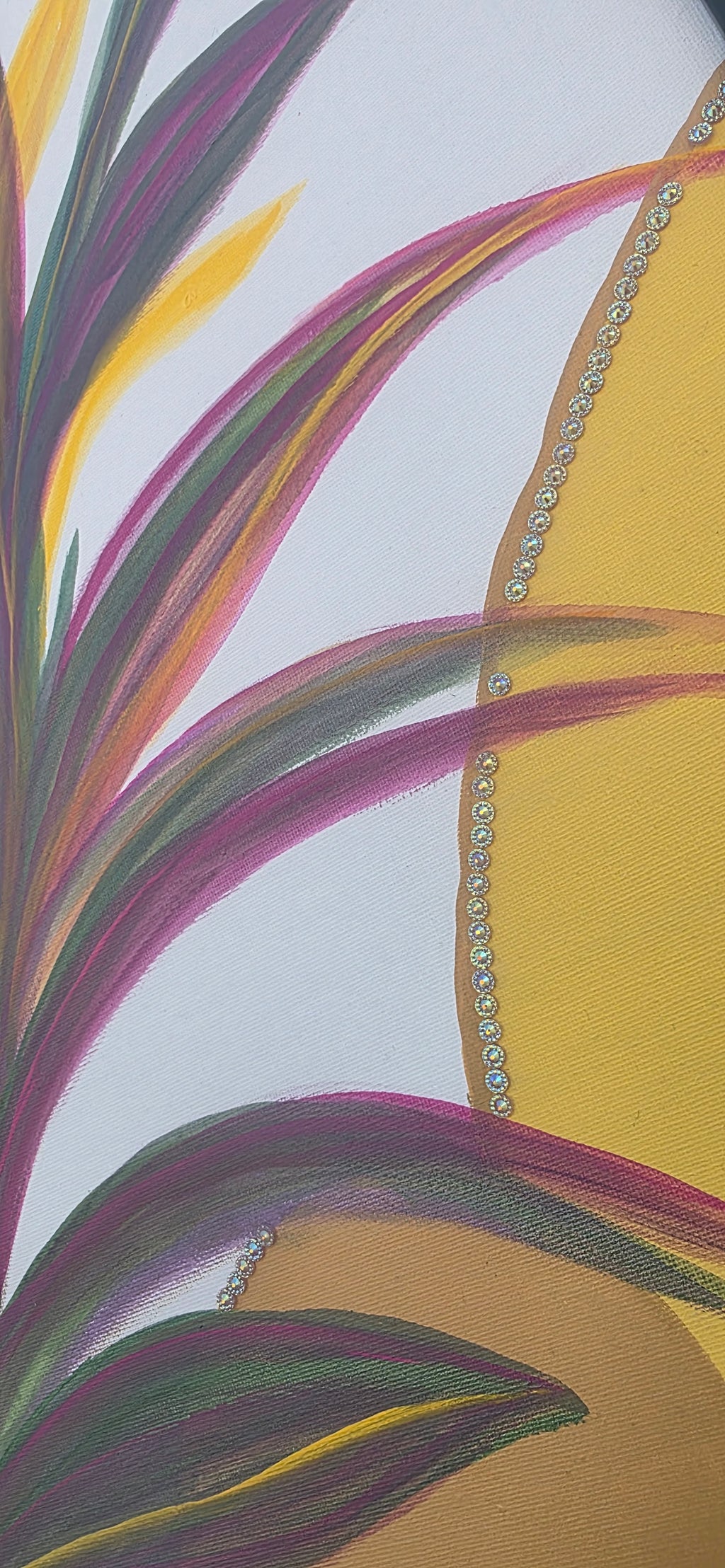 Close-up of a fabric with colorful abstract patterns and a textured border.