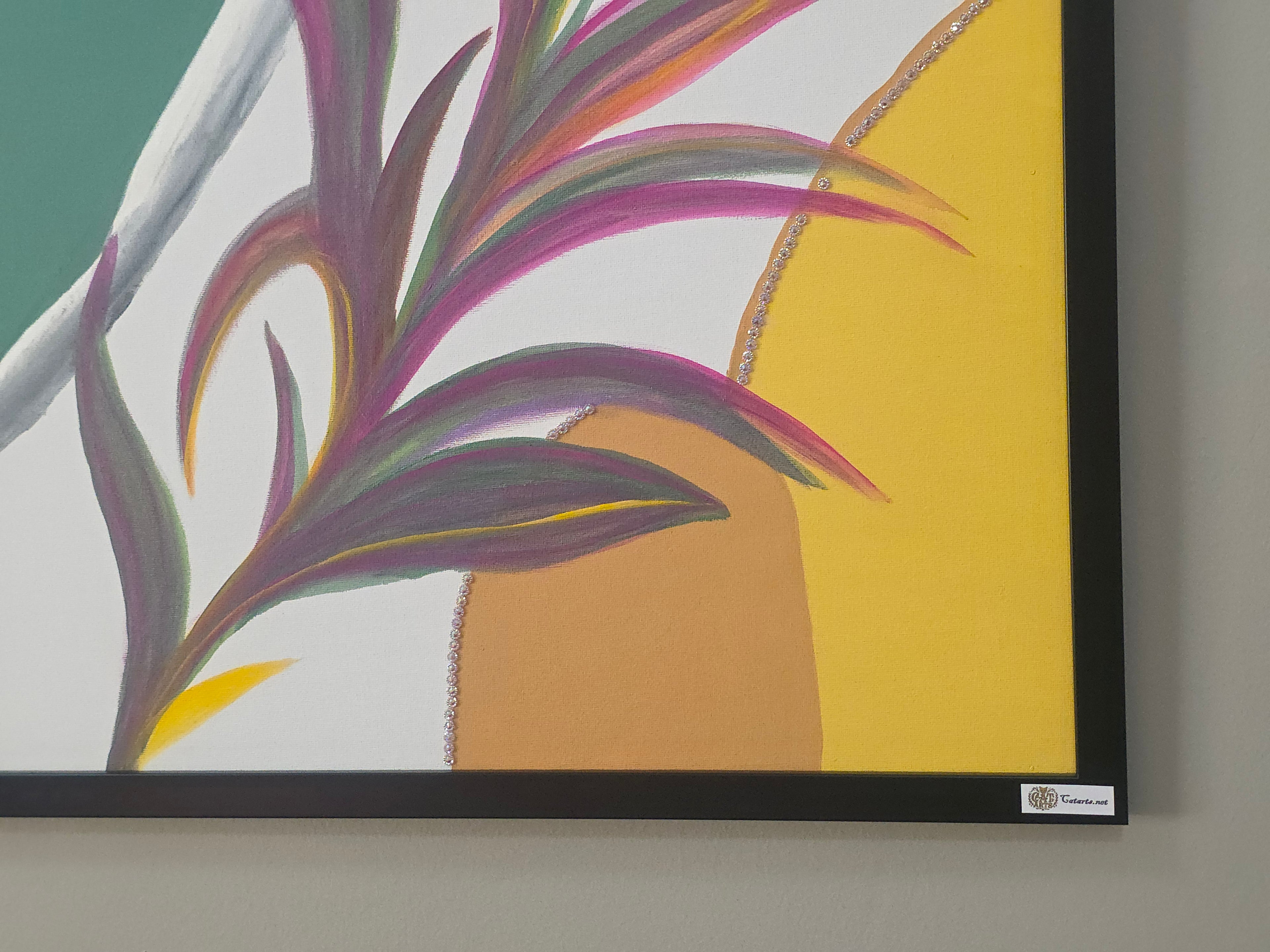 Framed abstract artwork with colorful leaves on a wall