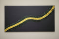 Full front view of Golden River original artwork, showcasing the winding 3D gold and green texture against a matte black background.