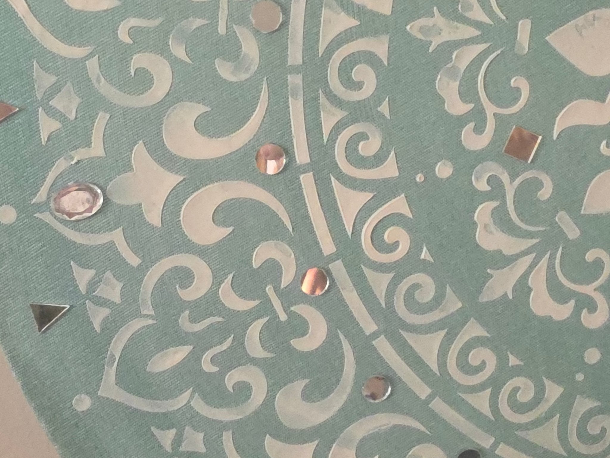 Detailed close-up of the raised texture and sparkling mirror fragments on the 'Mint Mandala Radiance' circular canvas