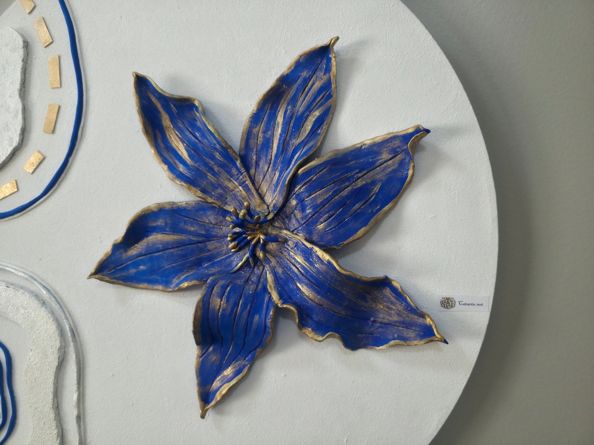 Detailed angled close-up of the 3D blue petals and textured background on the 'Royal Blue Blossom' canvas.